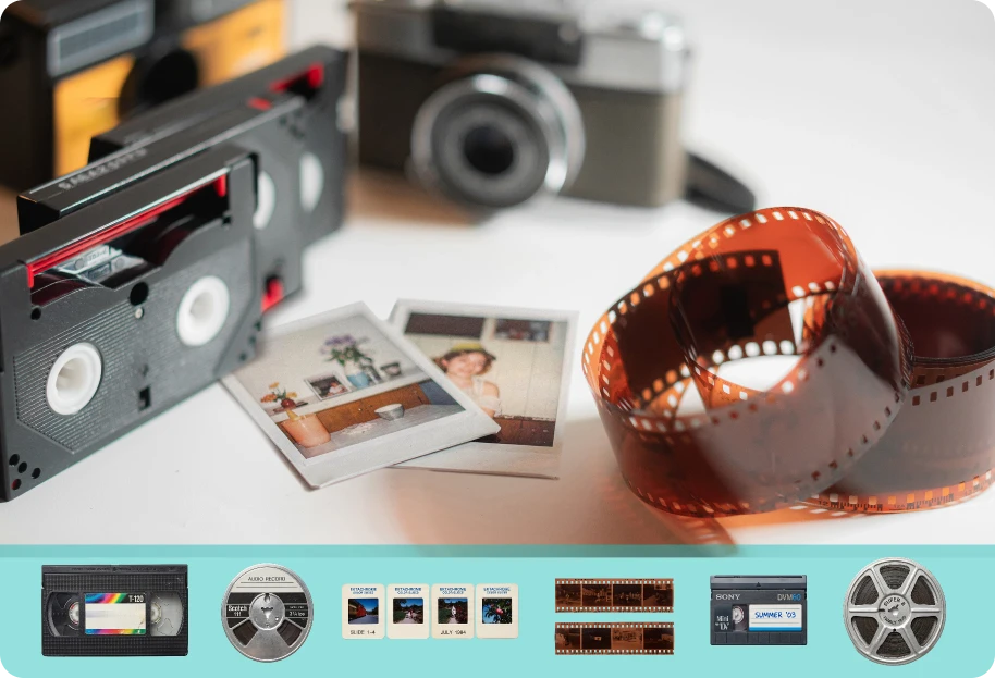 Cameras, video tapes, photos, and negatives pm a tab;e