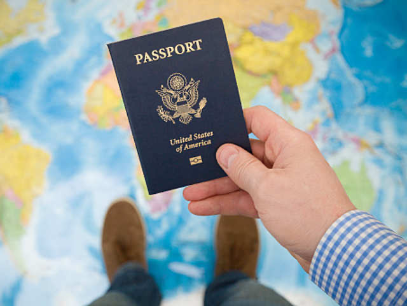 Hand holding a passport