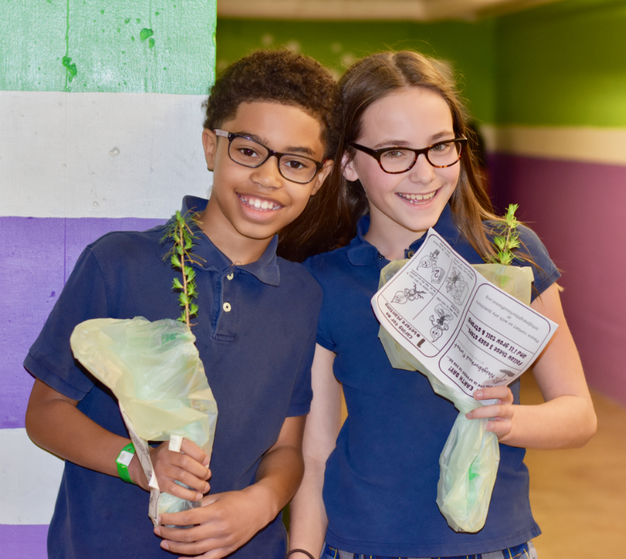 Boy and Girl holding free trees